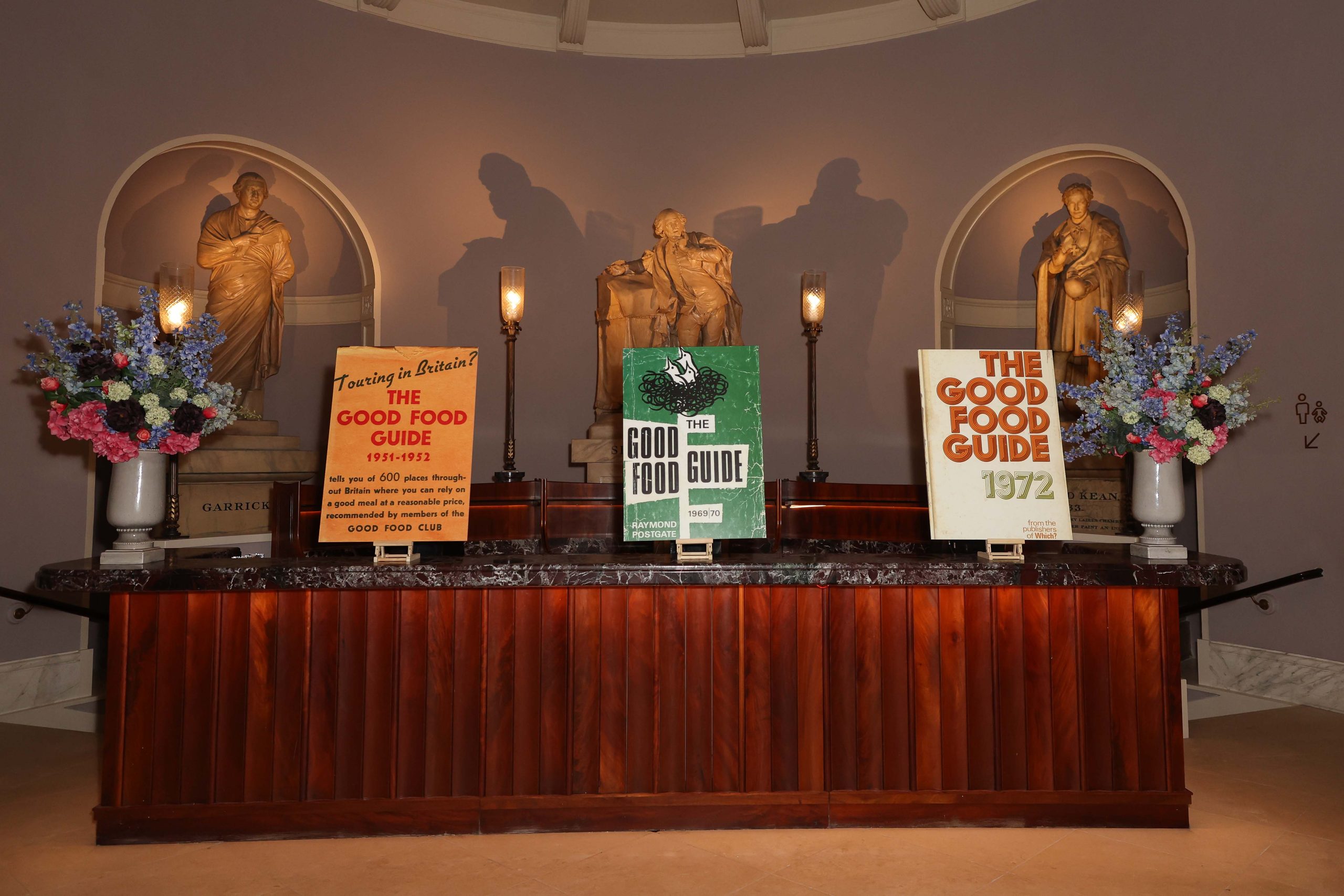 The Good Food Guide Awards 2024 A photo of three vintage Good Food Guides at the ceremony in London